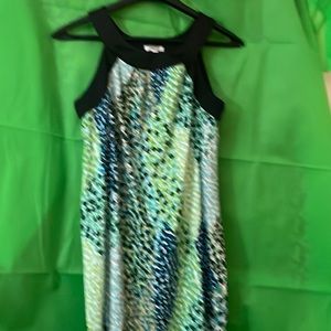 Mini dress, sleeveless multi colored with black trim, geometric  design